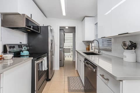 Brand new, stainless steel appliances including a dishwasher.