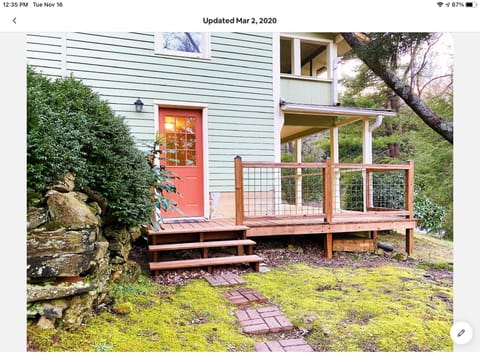 Entrance into the downstairs. Also leads to back porch with grill. 