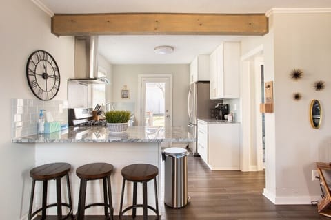 Kitchen area with 3 bar stools