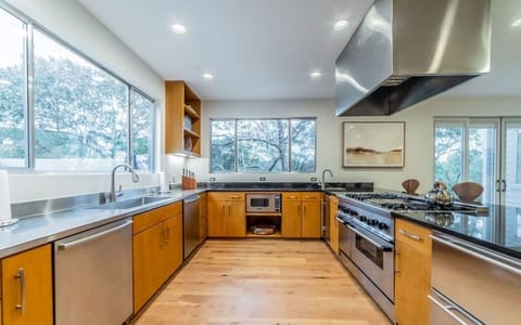 Kitchen w/ 2 dish washers, 6 burner stove with dbl ovens + griddle and ice maker