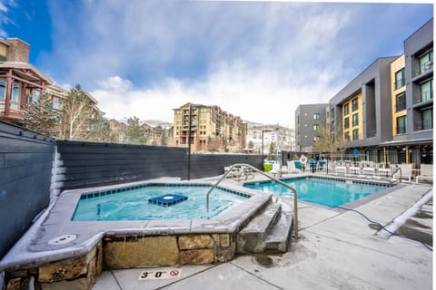 This oversized hot tub and heated pool are located just steps away from the home