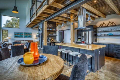 Welcome to Our Favorite Place! This stunning modern mountain luxury home has jaw dropping views, a hot tub under the stars & 4 bedrooms 2.5 baths.