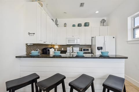 3rd Floor Full Size Kitchenw with Bar Seating