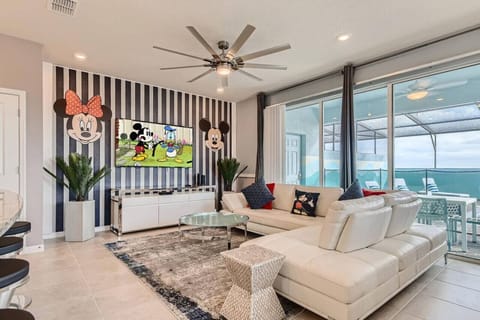 Spacious living room overlooking the pool in an open layout