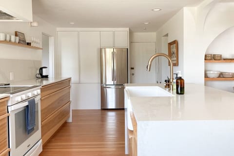 Beautifully constructed hickory cabinets and quartz countertops