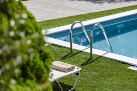 The villa features sundress and wonderful pool surroundings.