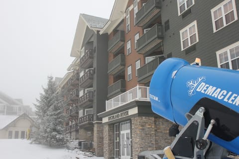 Condo is just beyond Highland House sign with slope view