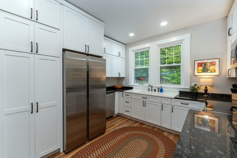 All new kitchen and appliances on the main level with bar seating for 3, dishwasher, and libation station.