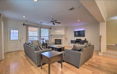 Living room with smart TV includes ROKU and a fireplace