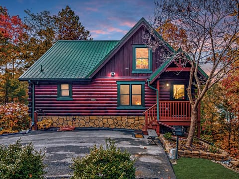 Cozy Misty Mountain cabin glowing beautifully at sunset