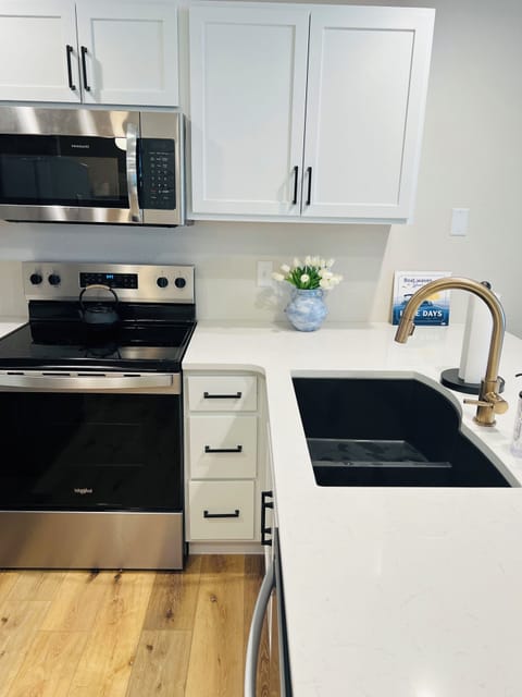 large open kitchen with new full size appliances and stocked kitchen