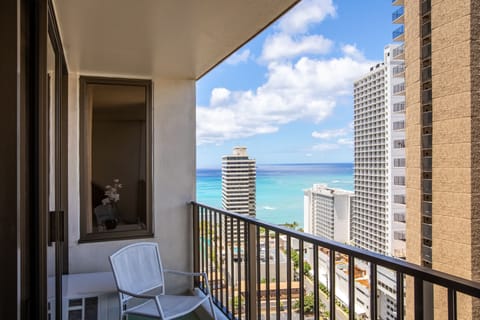 Sip morning coffee on your private balcony while soaking in stunning turquoise waters and vibrant city views—your perfect island escape awaits.
