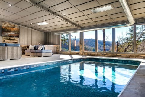 Large 20x12 heated Pool with large hot tub, seating and 65" TV with a beautiful view