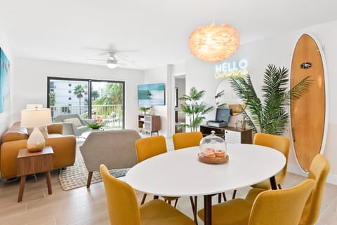 Bright and inviting dining area with stylish decor and seamless indoor-outdoor flow.