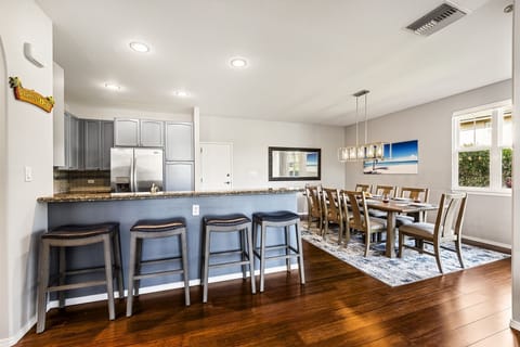 Open concept layout connects living room, dining, and kitchen