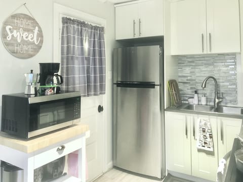 kitchen, refrigerator, microwave and sink