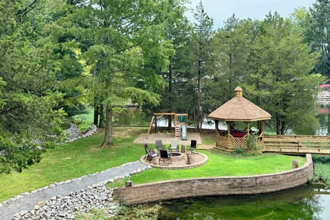 Fire pit, playground and gazebo all on flat ground next to the water