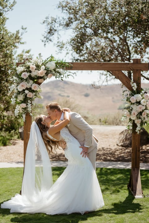 Wedding arch is available for for rent. Flowers aren’t included.