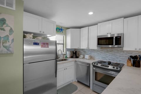 Recently remodeled kitchen has stainless appliances and new countertops - fully stocked to prepare meals in your home away from home