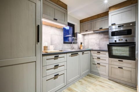 Curb your appetite by cooking a meal in your kitchen.