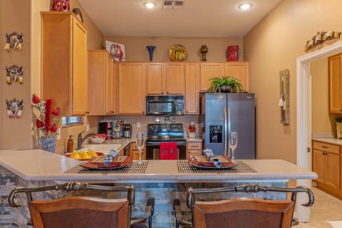 Contemporary kitchen has everything you need to prep and serve your favorite cuisine.