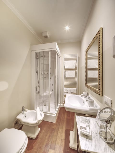 Designer toiletries, hair dryer, bidet, towels