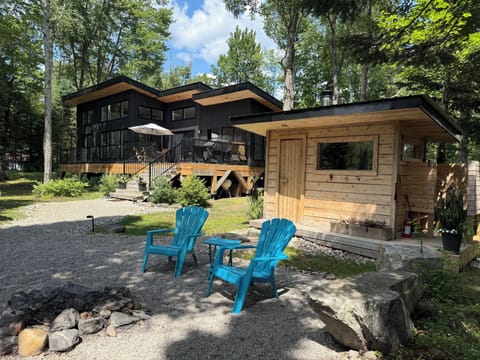 View of sauna and house from outdoor fire circle