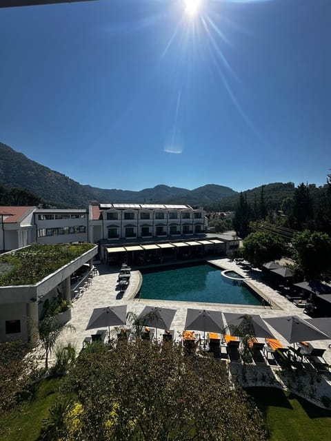 Indoor pool, seasonal outdoor pool, pool umbrellas, sun loungers