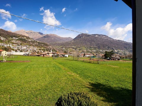 Sky, Mountain, Daytime, Building, Plant, Natural Landscape, House, Vegetation, Highland, Tree