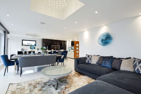 First floor: Sitting area with comfortable corner sofa, Smart television and views over Newquay