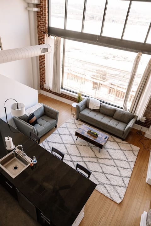 Living Room: Sunlit space with plush sofas, chic decor, and stunning views for relaxation or gatherings!
