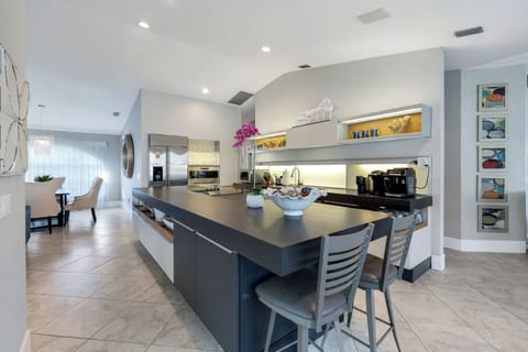 Contemporary kitchen featuring a large island, stainless appliances, and everything you need to cook and gather with ease