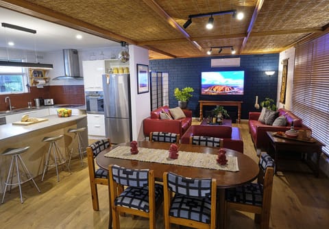 The living area is open to the kitchen and looks out over the front garden