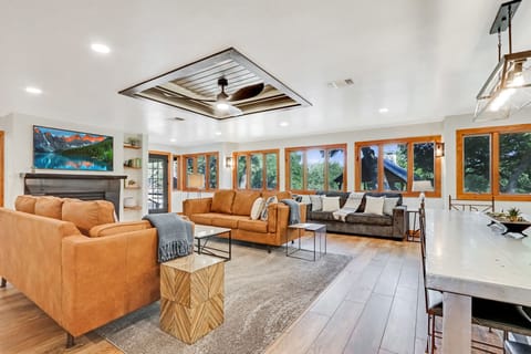 Windows surrounding the living area have a view down to the river