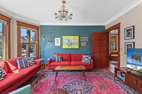 Sunshine-filled living room ideal for relaxing or gathering together.