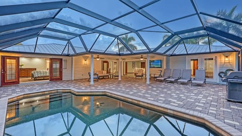 Screened-in pool and patio. Chaise lounges for soaking up the sun.  Sliding glass doors to bring the outside in including the tropical breezes.