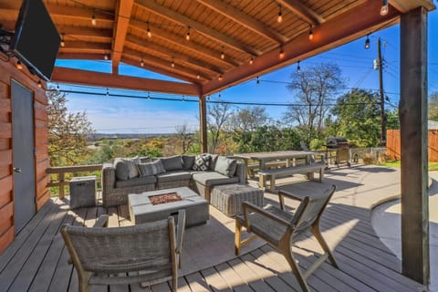 Covered backyard patio w fire pit, TV, lounge & dining furniture, propane grill