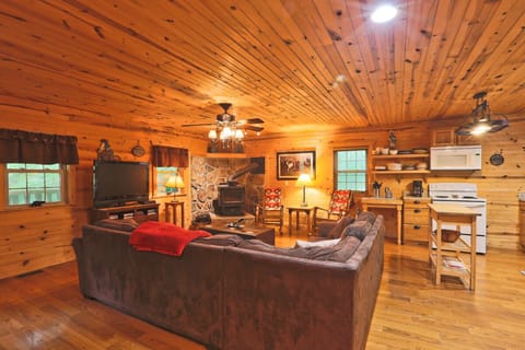 Living room with plenty of seating and a wood burning stove