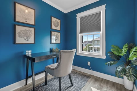 Settle into this charming nook, where botanical prints adorn the walls and natural light floods in, creating an inviting space for reflection, work, or a casual "hello" to the day ahead.