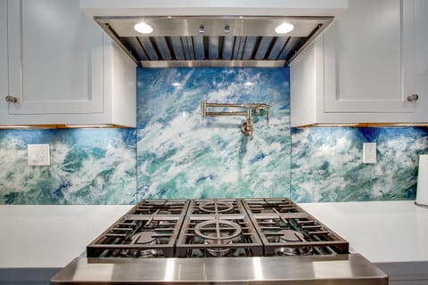 Custom designed backsplash, pot-filler, 6 burner gas range for your family gathering