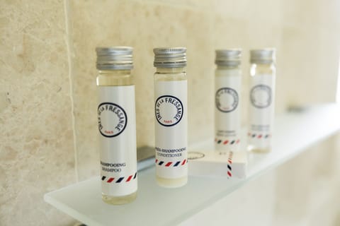 Premium Suite, 1 King Bed, Terrace | Bathroom amenities | Designer toiletries, hair dryer, bathrobes, slippers