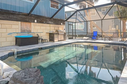 Large, private pool that is always heated! Outdoor kitchen and lost of seating