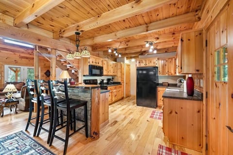 Large Open Kitchen With Bar Seating. Pantry and Large Laundry Room Off Kitchen