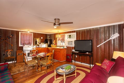 Sasquatch Cabin | Private kitchen | Cookware/dishes/utensils, dining tables