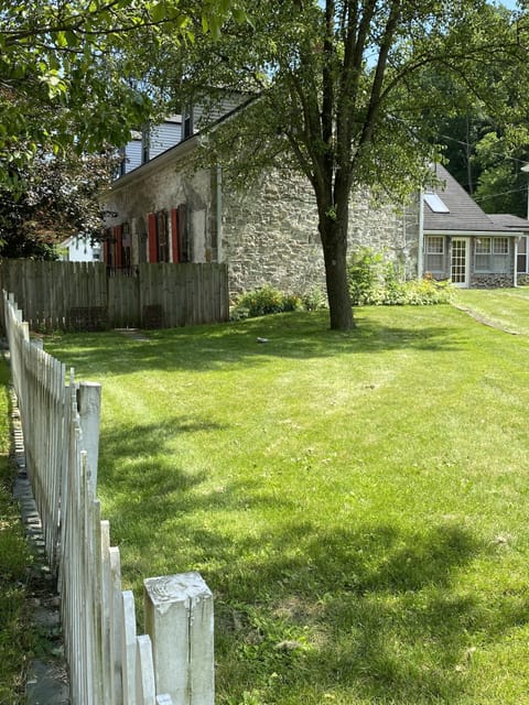 The spacious fenced-in yard is a favorite for pups, kids, and adults alike
