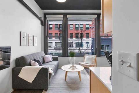 Relax in style—cozy seating with curated art and design accents.