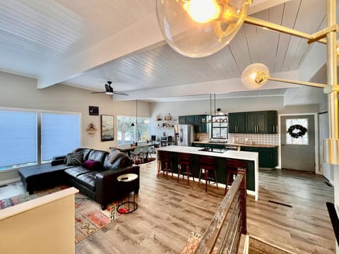 Beautifully renovated kitchen with large island and stainless steel appliances.