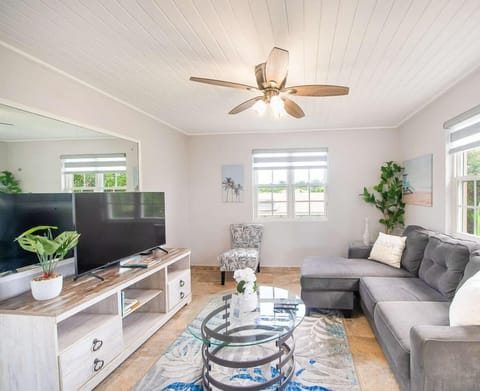 Relax in the cozy and stylish living room, complete with comfy sofas and a Smart TV for your entertainment.