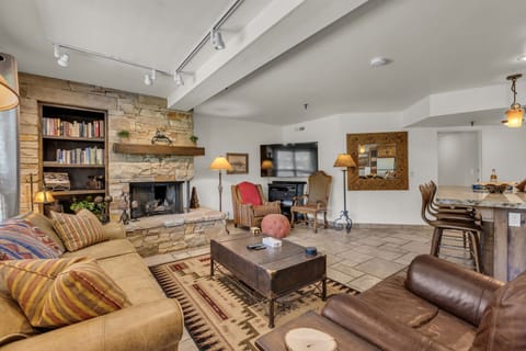 Living room: Smart TV, fireplace, open layout 