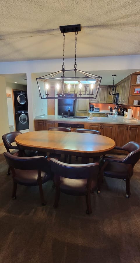 Dining area. Kitchen has pots, pans, dishes, utensils as needed. 